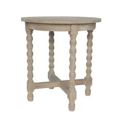 an old wooden table with turned legs and a round top, on a white background