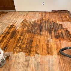 a room that has been cleaned and is being used as a wood flooring machine