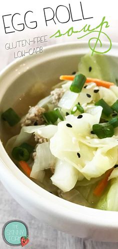 an egg roll soup in a white bowl with carrots and celery on the side