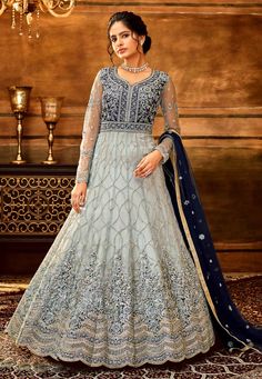 Grey net long anarkali suit 7925  Desc:  Style : Long Anarkali Suits Color : Grey Fabric : Net Work : Embroidery Wash Care : Dry clean Sleeve Style : Full Sleeve Long Sleeves : Done only in Custom Stitch Sleeves Lining : Done only in Custom Stitch Bust Size : 32 to 42 Inches Occasion : Wedding   Mehendi   Sangeet   Engagement   Reception   Ceremonial. With Express Free Shipping and Custom Stitching, Buy Indian Party wedding wear bridal Anarkali Salwar Grey net long anarkali suit 7925 online in U Long Anarkali Gown, Bridal Anarkali, Women Gown, Sangeet Outfit, Princess Vibes, Long Anarkali, Embroidered Anarkali, Gown Skirt, Salwar Kamiz