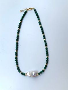 This eye catching necklace is made of natural gemstones (malachite, fresh water pearl) and gold filled silver beads. Original jewelry for every day and for special occasion. The necklace measures 42cm + 2,5 extension chain, but the length can be modified upon request. The necklace comes in our signature box, ready to gift. Handmade in Spain. Free shipment worldwide. Green Necklace With Pearl Pendant And Round Beads, Green Necklaces With Pearl Pendant And Round Beads, Malachite Necklace With Natural Round Beads, Malachite Natural Stones Round Beads Necklace, Handmade Gold Malachite Necklaces, Handmade Gold Necklaces With Malachite, Malachite Beaded Necklace As Gift, Malachite Gemstone Necklaces With Round Beads, Malachite Beaded Necklace For Gift