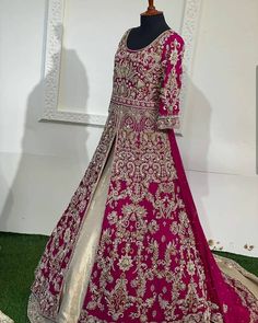 a mannequin wearing a pink and gold lehenga