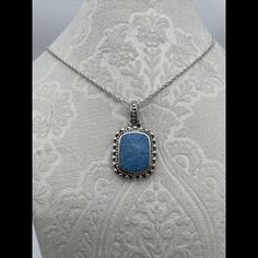 Blue Stone Amulet Pendant In Sterling Silver Marked 925 Thai Large Bail And 20" Sterling Rope Chain 1 Gorgeous Oval Blue Stone Makes A Lovely Gift Blue Rectangular Pendant Jewelry For Formal Occasions, Blue Gemstone Jewelry With Rectangular Pendant, Elegant Blue Jewelry With Silver Chain, Blue Jewelry With Silver Chain For Gifting, Elegant Blue Necklace With Silver Chain, Blue Pendant Jewelry With Silver Chain, Blue Sterling Silver Jewelry With Silver Chain, Blue Pendant Necklace Stamped 925, Blue Sterling Silver Jewelry With Adjustable Chain