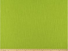 green fabric with a ruler in front of it and the width of the fabric is shown