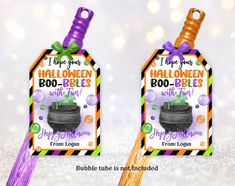 two halloween boo - balls with witch broom tags