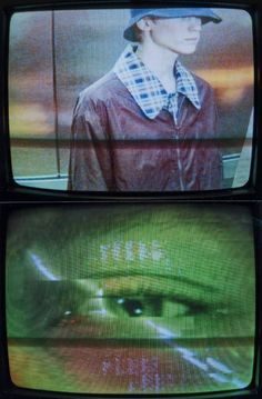 two televisions with an image of a person wearing a hat on top of them