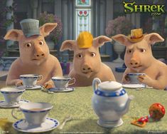 three pigs sitting at a table with tea cups and saucers