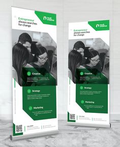 two roll - up banners with the same image on them, one is green and the other is white