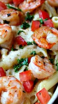 a close up of a plate of pasta with shrimp and tomatoes on it, text overlay reads olive garden baked parmesan shrimp