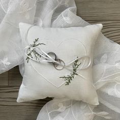 a white pillow with scissors tied to it