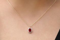 "Ruby Necklace / 14k Classic Oval Cut Ruby with Surrounding Diamonds / Natural Ruby Necklace in 14k Solid Gold / Mothers Day Gift Item Features *Made to Order. *Gold KT: 14K *Custom Gold Color: Rose Gold, Yellow Gold, White Rhodium *Oval Ruby Size: 1 Oval Ruby 6x4MM in Size *Round Diamonds: 14 Round diamonds 1.30MM in Size *Total Ruby ctw: 0.55ctw *Total Diamond ctw: 0.15ctw *Diamond Color-Clarity: G Color SI Clarity *Setting Type: Prong *Ready to Ship in 7-10 Business Days Be sure to hit \"favo 14k Gold Oval Halo Jewelry, Gold Oval Jewelry With Halo Design, Oval 14k Gold Halo Jewelry, Oval 14k Gold Halo Design Jewelry, Gold Necklace With Halo Setting And Oval Pendant, Oval Yellow Gold Necklace With Halo Setting, Oval Halo Yellow Gold Necklace, Ruby Necklace Designs, Ruby Jewelry Necklaces