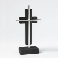 a black and silver cross on a white background