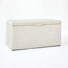 an upholstered storage box is shown on a white background