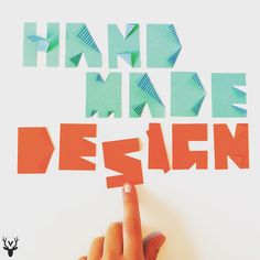 a hand is pointing to the word design