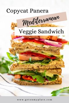 a stack of veggie sandwiches with text overlay that reads copycat panera mediterranean veggie sandwich