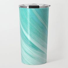 a blue and green travel mug on a white background