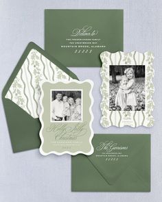 the green and white wedding stationery is shown