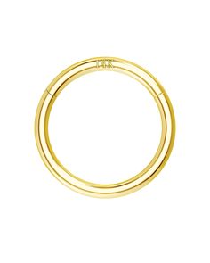 a gold ring on a white background