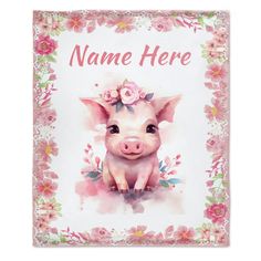 a pink pig with flowers on it's head is sitting in front of a floral frame