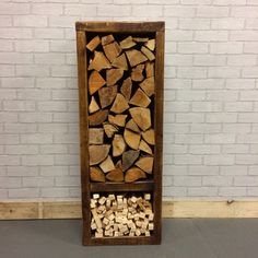 a firewood storage unit made out of wood