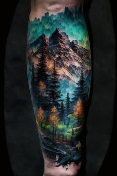 a man's leg with an image of mountains and trees on it