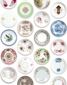 a table topped with lots of plates covered in floral designs