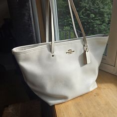 Beautiful Everyday Large Tote/Handbag In Excellent Condition. Exterior And Interior In Pristine Condition. Thanks For Looking. White Coated Canvas Shoulder Bag With Gold-tone Hardware, Gold Coach Tote Shoulder Bag, White Tote Bag With Gold-tone Hardware, White Tote Shoulder Bag With Gold-tone Hardware, Coach Hobo Tote Bag With Gold-tone Hardware, Large Tote, Womens Tote, Coach Bags, Large Bags