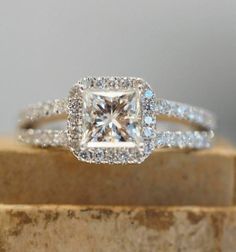 an engagement ring with a princess cut diamond in the center