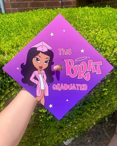 someone is holding up a purple graduation cap that says, this bratt squad painted on it