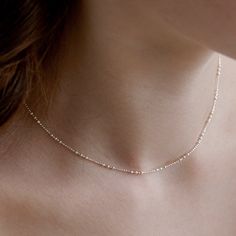 Dainty Satellite Chain Choker Necklace,Delicate Layering Chain Necklace with Triple Ball Details,Minimalist Bead Choker,Gift for Her(NZ2406) ▶ Product Info. - Material: 925 Sterling Silver / Cubic Zirconia  - Metal Finish: 14K Gold / Silver + Anti-Tarnish E-Coat  - Safety: Nickle & Lead free and Haypoallergenic - Dimensions: Cubic Zirconia - 3.5mm - Length: 39cm + 3.5cm (length adjustable) - Weight: 2g - TATIANA & Silver 925 engraved tag was added. - Made In South Korea Our jewelry was plated with a high-content gold/silver layer to minimize the discoloration, compared to regular non-plating one. ▶Shipping and Return Policies Order today to get by  Date (14days) Return & exchanges accepted within 30days Cost to ship : USD 7.00 ▶Cancellations Cancellations : accepted Request a cancellation Minimalist Ball Chain Necklace As Gift, Minimalist Ball Chain Necklace For Gift, Minimalist Chain Necklace With Adjustable Chain And Round Beads, Dainty Ball Chain Necklaces As Gifts, Dainty Ball Chain Necklace For Gift, Rose Gold Beaded Chain Necklace As Gift, Rose Gold Beaded Chain Necklace Gift, Dainty Clavicle Chain Necklace With Round Beads, Delicate Silver Chain Necklace With Satellite Chain