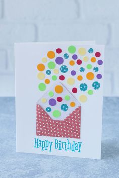 a birthday card with an envelope filled with confetti