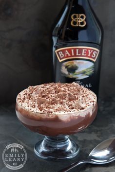 a chocolate dessert with whipped cream and bailey's syrup