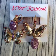 Betsey Johnson Butterfly Earrings With Rhinestones. New Purple Party Earrings With Sparkling Stones, Purple Sparkling Stones Earrings For Party, Purple Crystal Metal Earrings For Party, Unique Purple Jeweled Dangle Jewelry, Purple Jeweled Earrings As Gift, Purple Jeweled Earrings For Gift, Purple Crystal Jeweled Earrings, Purple Jeweled Crystal Earrings, Purple Metal Crystal Earrings For Gift