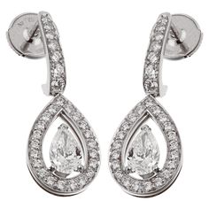 A stunning pair of Fred of Paris diamond drop earrings, each earring showcases a .51, and .52ct central pear shaped diamond adorned with round brilliant cut diamonds in shimmering 18k white gold. Each central pear shaped diamond is accompanied with a GIA certificate.Both pear shaped diamonds are E color, VVS2 clarity. Total Diamond Weight: 1.62ct Sku:2756 Ruby And Diamond Necklace, Paris Jewelry, Gold Link Necklace, Pearl Jewels, Pearl And Diamond Necklace, White Gold Earrings, Pear Shaped Diamond, Diamond Drops, Diamond Drop Earrings