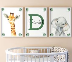 a baby's nursery room with two prints on the wall and a crib