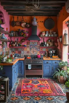 a kitchen with colorful walls and flooring has an area rug on the floor that matches the stove