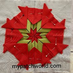 a close up of a piece of fabric that has been stitched together to make an ornament