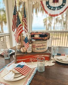 an american flag themed table setting on a porch