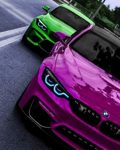 two colorful cars parked next to each other