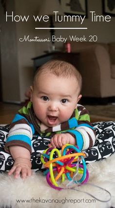 a baby is playing with a toy on the floor