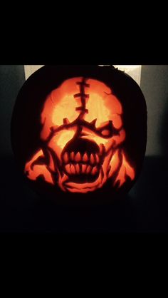 a carved pumpkin with an evil face on it