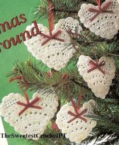 three crocheted hearts hanging from a christmas tree with the words christmas ground written on them