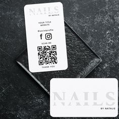 two business cards sitting next to each other on top of a black surface with the words nails by natalie