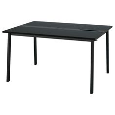 a black table sitting on top of a white floor