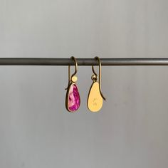 Organic in form, these rubies are packed with lush and lively pink personality. 18k yellow gold Rubies, 2.53ctw, 7mm x 12mm (1/4" x 1/2") Earrings hang 15/16" from the ear Each earring weighs 1.3g Ruby Earrings In Yellow Gold For Gift, Ruby Yellow Gold Earrings For Gift, Yellow Gold Ruby Earrings For Gift, Single Pink 14k Gold Earring, Pink Oval Ruby Earrings, Rose Gold Pink Sapphire Earrings As Gift, Rose Gold Pink Sapphire Earrings For Gift, Teardrop Ruby Jewelry In Yellow Gold, Yellow Gold Teardrop Ruby Earrings