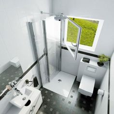 an aerial view of a bathroom with a toilet, sink and shower