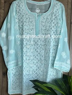 Chikankari hand embroidered kurti top on georgette.  Intricate hand embroidery with 'Mukaish' add ons.  Length: 30 inches Sleeves: 3/4 th Luxury Chikankari Embroidered Tops For Festive Season, Chikankari Short Kurti, Kurti Blouse, Kurti Top, Embroidered Kurti, Short Kurti, White Chiffon, Add Ons, Crochet Lace