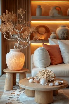 a living room filled with lots of furniture and decor on top of a carpeted floor