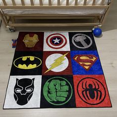 a child's room with a crib and various rugs on the floor