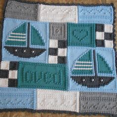 a crocheted blanket with boats on it